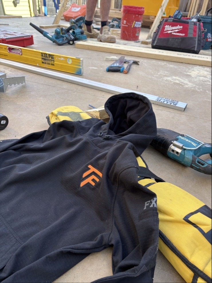 A Terra Firma Built hoodie on the job among site tools